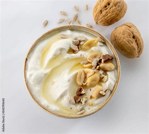 greek yogurt with honey syrup and nuts Stock Photo | Adobe Stock