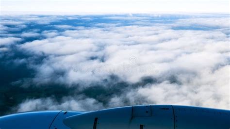 Airplane above clouds stock image. Image of light, landscape - 128124469