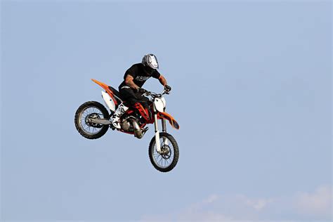 Dirt Bike Stunts - In The Air II Photograph by Debbie Oppermann - Fine Art America