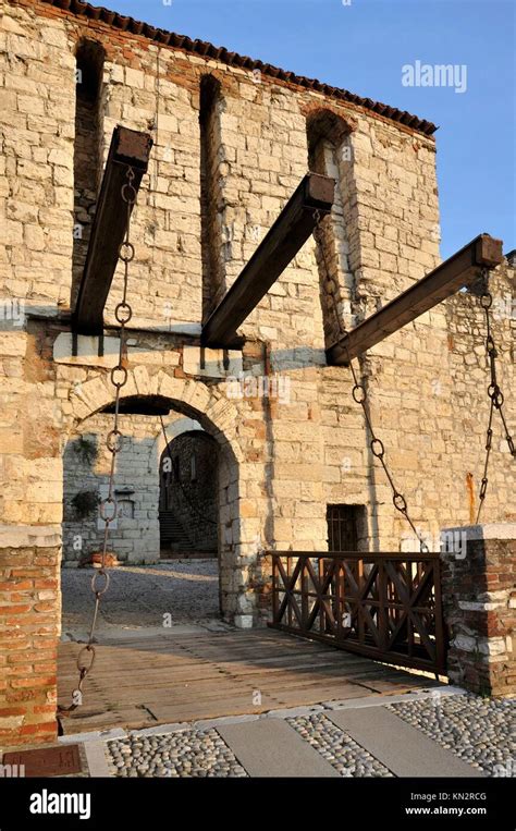 castle drawbridge, brescia, view of drawbridge in medieval castle on a hill towering above the ...