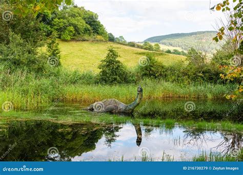 Pond with a Sculpture of Loch Ness Monster Nessie in Drumnadrochit Village in Scotland Editorial ...