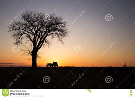 Silhouette of One Tree and Semi Truck at Sunset Stock Photo - Image of truck, wheeler: 70372932