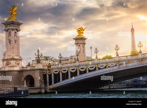 Eiffel Tower and Pont Alexandre III at dramatic sunset, Paris, france ...