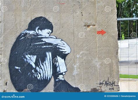 Small Boy Hiding Himself with Fear Pained on the Berlin Wall - Graffiti Art Editorial Photo ...