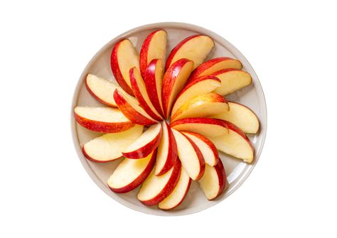 White plate with slices of red apple fruit isolated on a transparent background 22025065 PNG