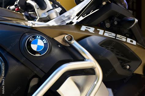 BMW R 1250 GS motorcycle closeup view with blue and white circular logo and badge and chrome ...