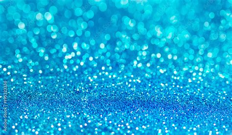 Blue defocused glitter background with copy space. Holiday texture. Wallpaper. Glitter light ...