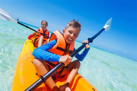 Kids,Enjoying,Paddling,In,Orange,Kayak,At,Tropical,Ocean,Water - Best Western Plus Siesta Key ...