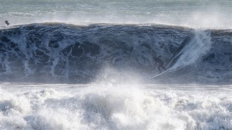 NJ storm produces monster waves as surfers hit the beaches