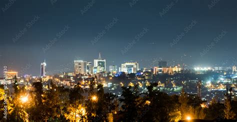 A wide view of Kigali city skyline lit up at night Stock Photo | Adobe ...