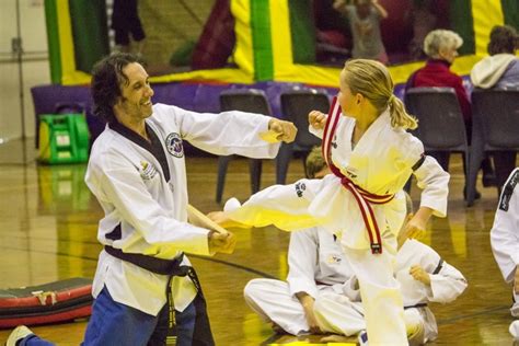 Narelle with a great side kick Board Break at Taekwondo Central Demo – www.tkdcentral.com