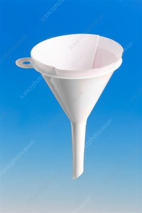 Filter paper in a plastic funnel - Stock Image - C028/8176 - Science Photo Library