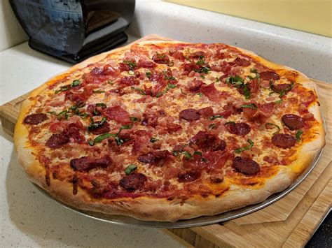 Pepperoni, bacon crumble, and prosciutto with some basil on a homemade crust. Probably one of ...