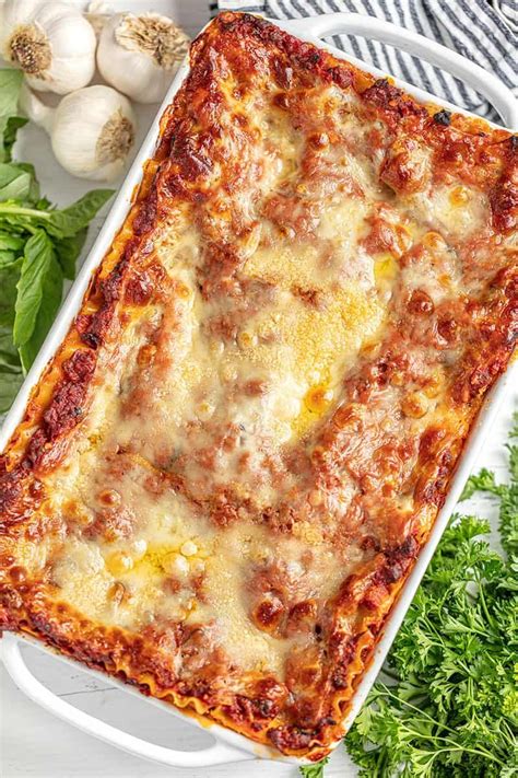 Lasagna in a white baking dish | Homemade lasagna recipes, Homemade lasagna, Easy lasagna recipe