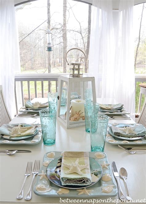 Beach Themed Table Setting Tablescape With Lighthouse Lantern and Shell, Sailboat Dishware