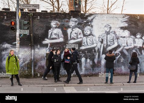 The famous Berlin Wall East Side Gallery, showing murals on the remains of the Berlin Wall in ...