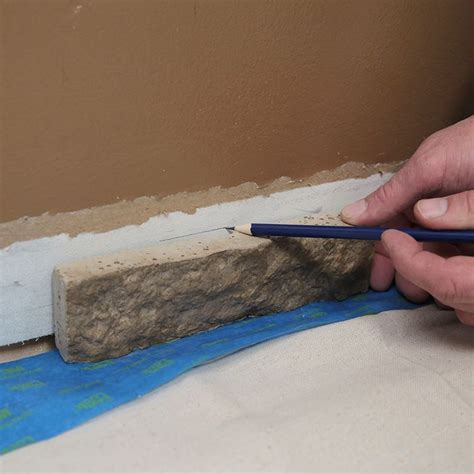 How to Install Faux Stone Veneer | Lowe's | Stone veneer, Faux stone ...