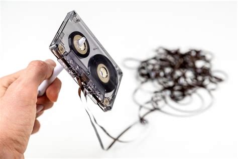 Premium Photo | Rewind a old cassette tapes with loose tape