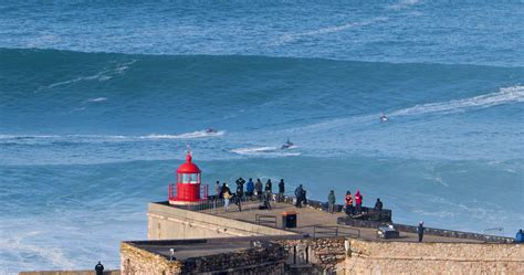 Nazare, Portugal - November 7, 2022 People watching the big giant waves in Nazare, Portugal ...