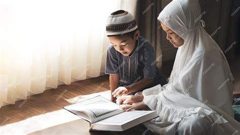 Premium Photo | Religious Asian Muslim kids learn the Quran and study Islam after pray to God at ...