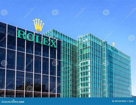 The Rolex Logo At The Top Of The Headquarters Building In Geneva ...