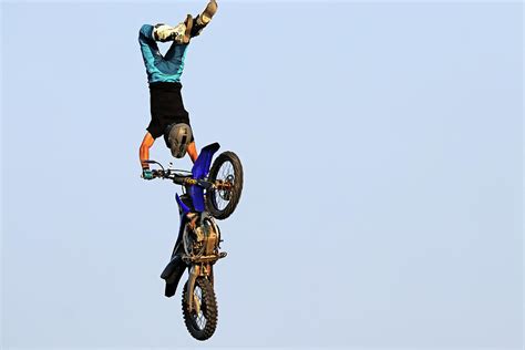 Dirt Bike Stunts - In The Air XII Photograph by Debbie Oppermann - Pixels