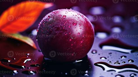 Photo of Japanese plum fruit half against a colorful abstract ...