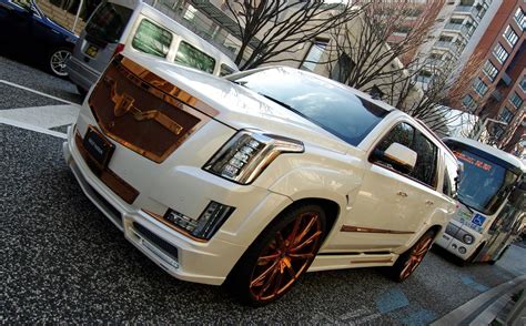 Fully Customized White Cadillac Escalade on Bronze Custom Wheels — CARiD.com Gallery