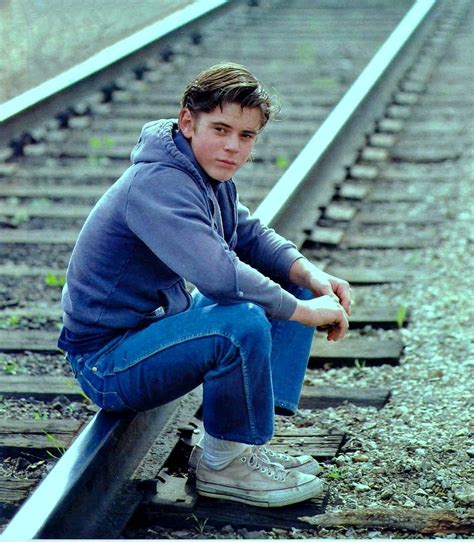 sitting on railroad tracks