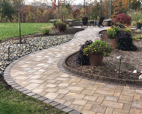 Interlocking concrete paver walkway in CT by Bahler Brothers with lighting and landscaping ...