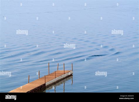 Fishing dock in a lake Stock Photo - Alamy