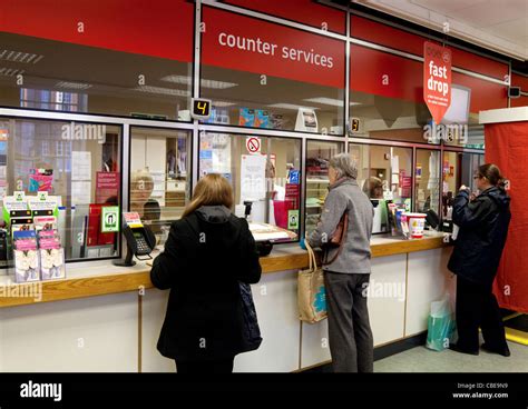 Queue at post office uk hi-res stock photography and images - Alamy