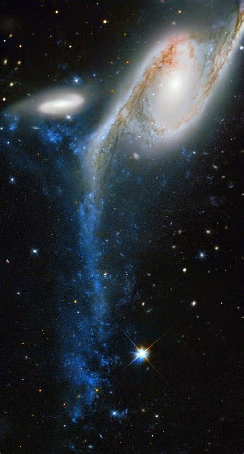 The galaxy NGC 6872, in the constellation the Peacock, about 300 million light-years from Earth ...