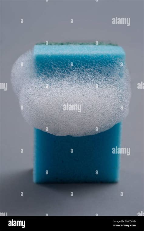 A cleaning sponge with foam Stock Photo - Alamy