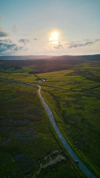 Premium Photo | Aerial view of a country road with a country road in the background