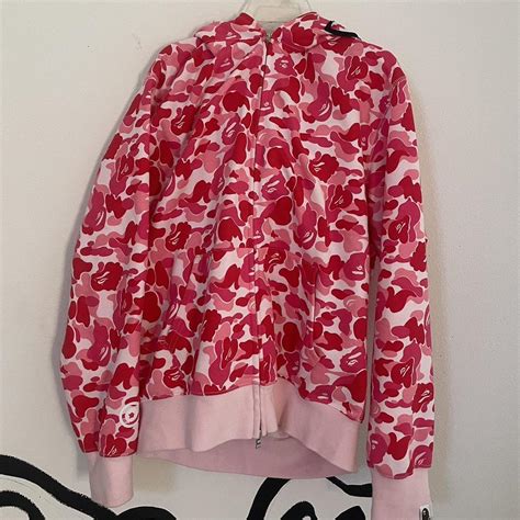 pink BAPE zips up hoodie worn once size XL but... - Depop