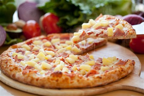 Hawaiian Pizza lifted slice - Waiter.com Food Delivery Blog