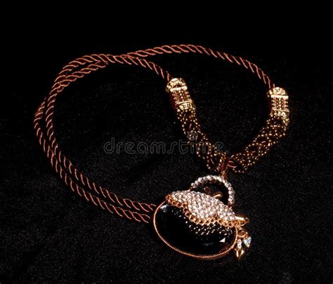 Jewelry on Black Background Stock Photo - Image of golden, glimmer: 23745150