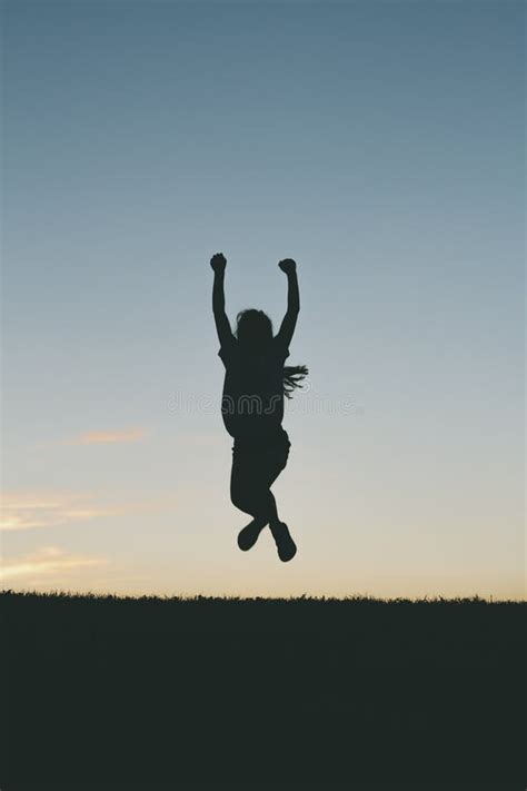 Children Jumping at Sunset Silhouette Stock Photo - Image of fitness ...