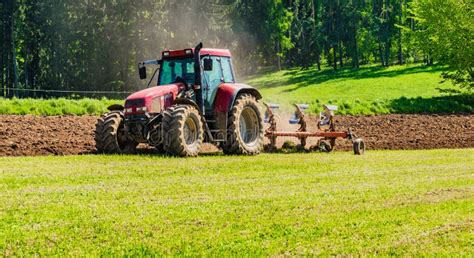 Farmer In Tractor Plowing Field Stock Photo - Image of dairy, farm: 22983960