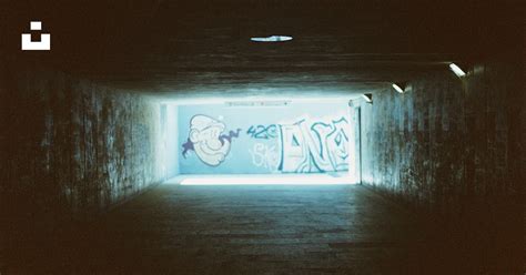 A dark tunnel with graffiti on the walls photo – Free Film photography Image on Unsplash