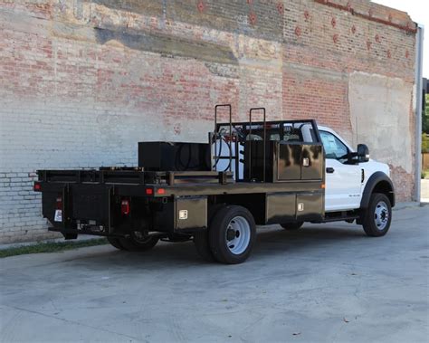 12′ Douglass framed steel flatbed built for a 84″ cab-to-axle DRW Ford F550. This flatbed ...