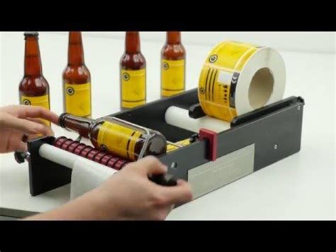 a person using a machine to make beer bottles