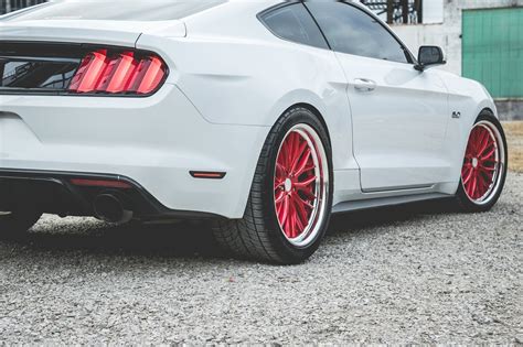 Striking Contrast: Custom Red Vossen Wheels on White Ford Mustang — CARiD.com Gallery