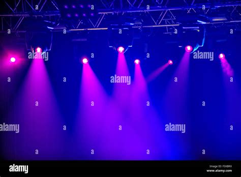 Red stage spotlights Stock Photo - Alamy