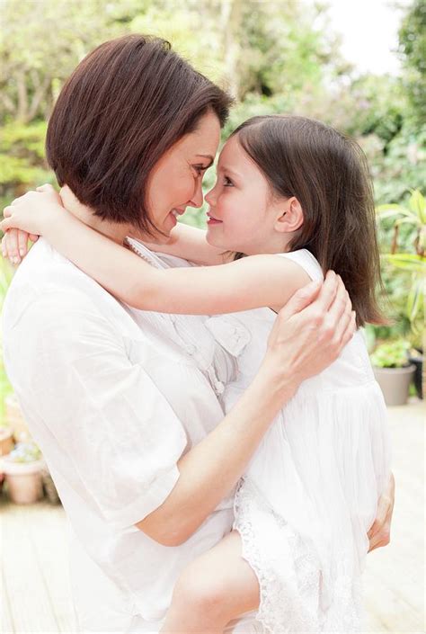 Mother And Daughter Hugging Photograph by Ian Hooton - Pixels