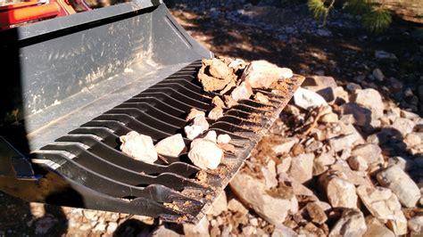 Bucket Rake turns front-end loader into a rock picker