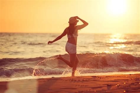 Running barefoot on the beach — Stock Photo © mike_laptev #113416140