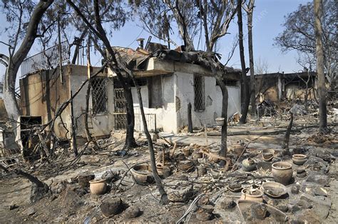 Exterior of a fire damaged house - Stock Image - C048/1866 - Science Photo Library