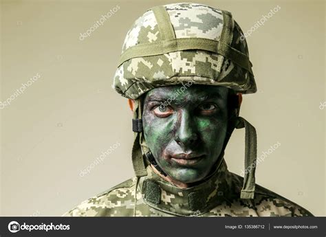 Soldier Face Paint Grey Background Stock Photo by ©belchonock 135386712